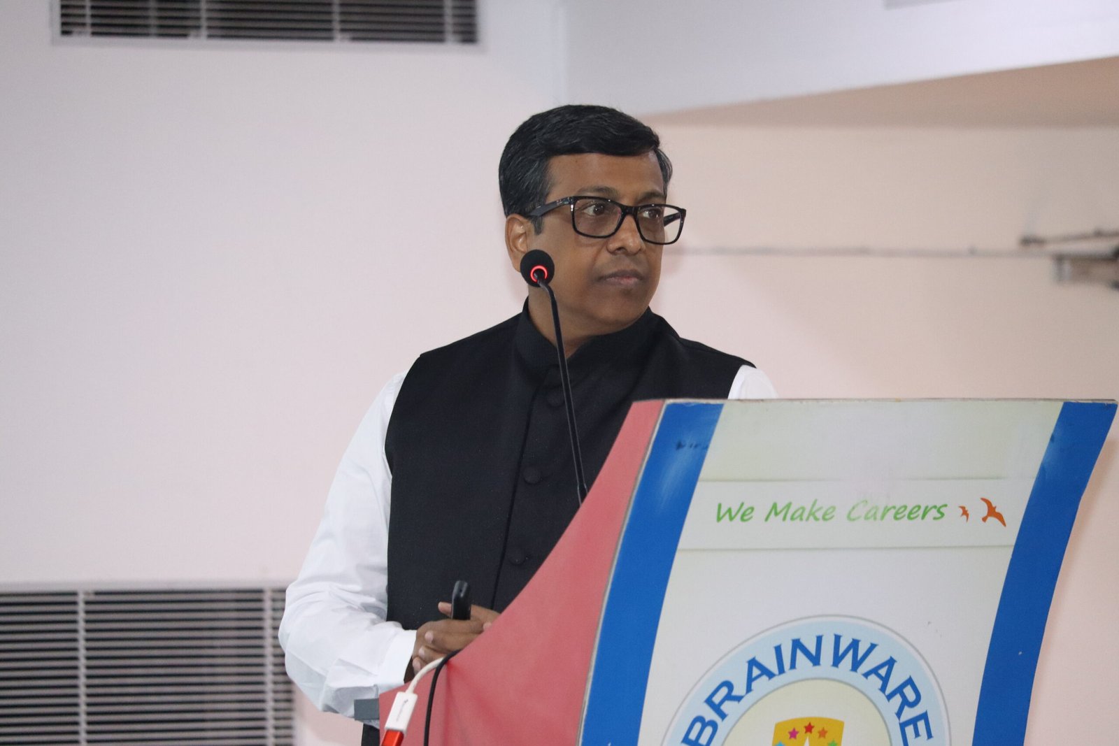 Avijit Patra at the Brainware University podium delivering the LLM and Threats keynote at SecCon 2023