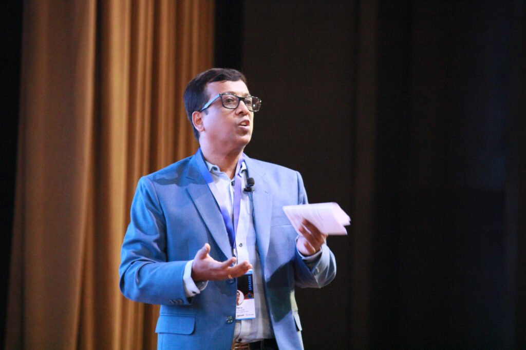 Avijit Patra speaking on stage at Google Cloud Community Days Kolkata 2023
